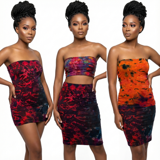 Three women wearing colorful strapless outfits with a white background