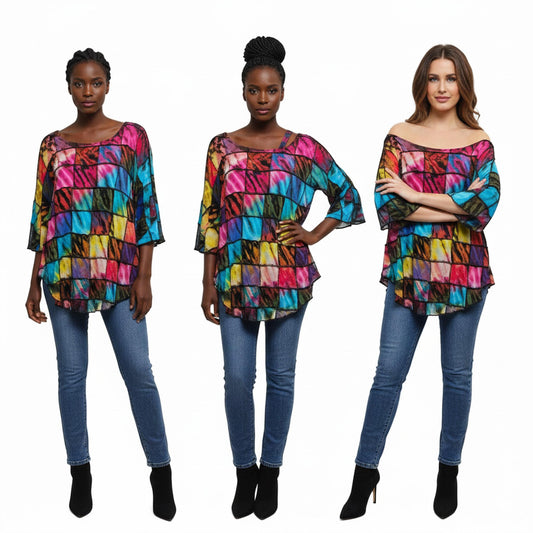 Three women wearing colorful patchwork tops and blue jeans on a white background