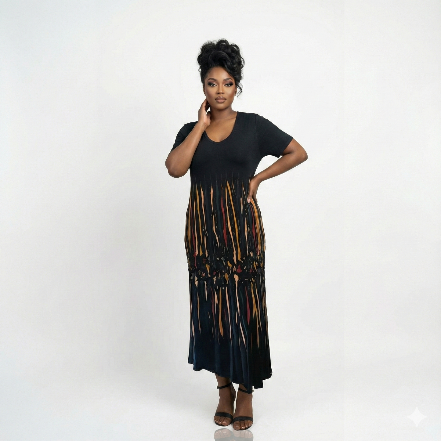 Woman wearing a black dress with a colorful pattern on a white background