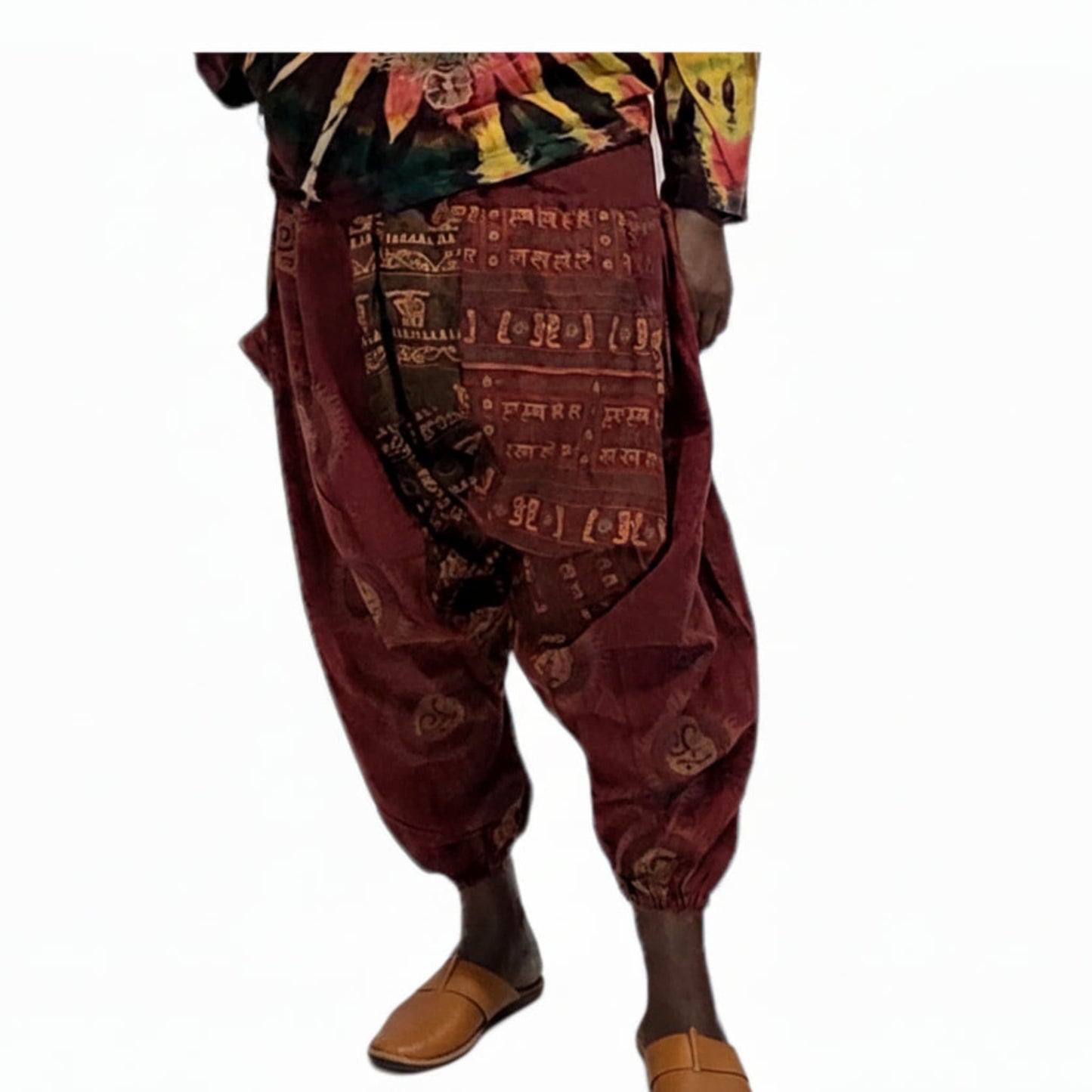Maroon patterned harem pants with a colorful top on a white background