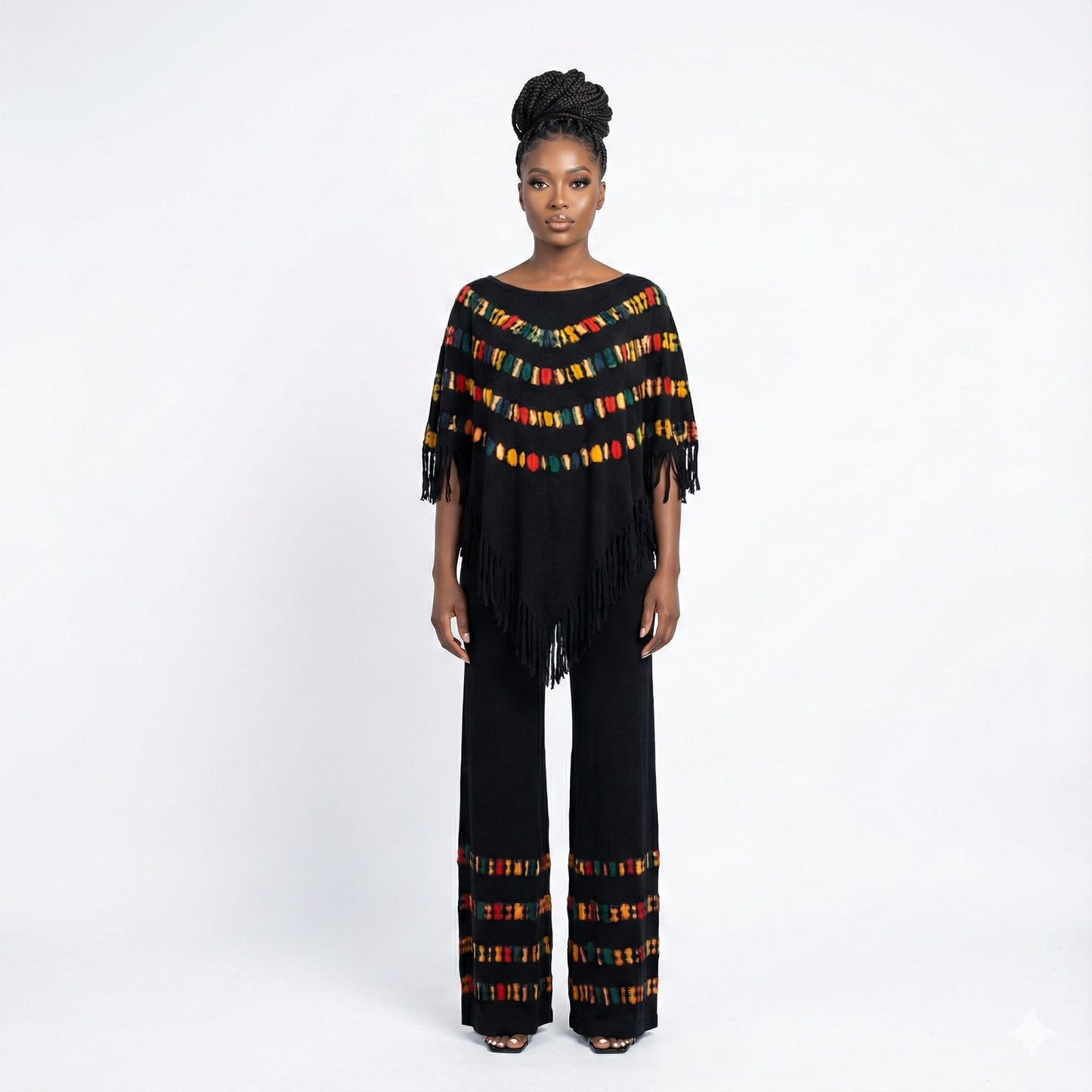 Woman wearing a colorful poncho with fringe on a white background SanJules