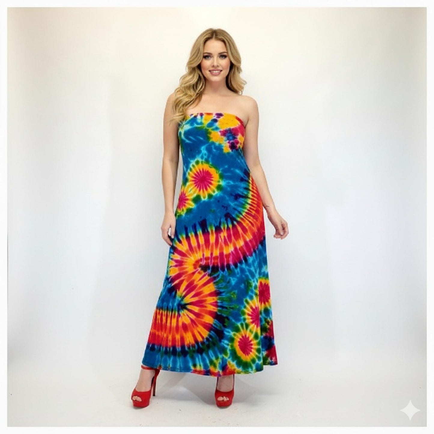 Woman wearing a colorful tie-dye strapless dress on a white background. SanJules