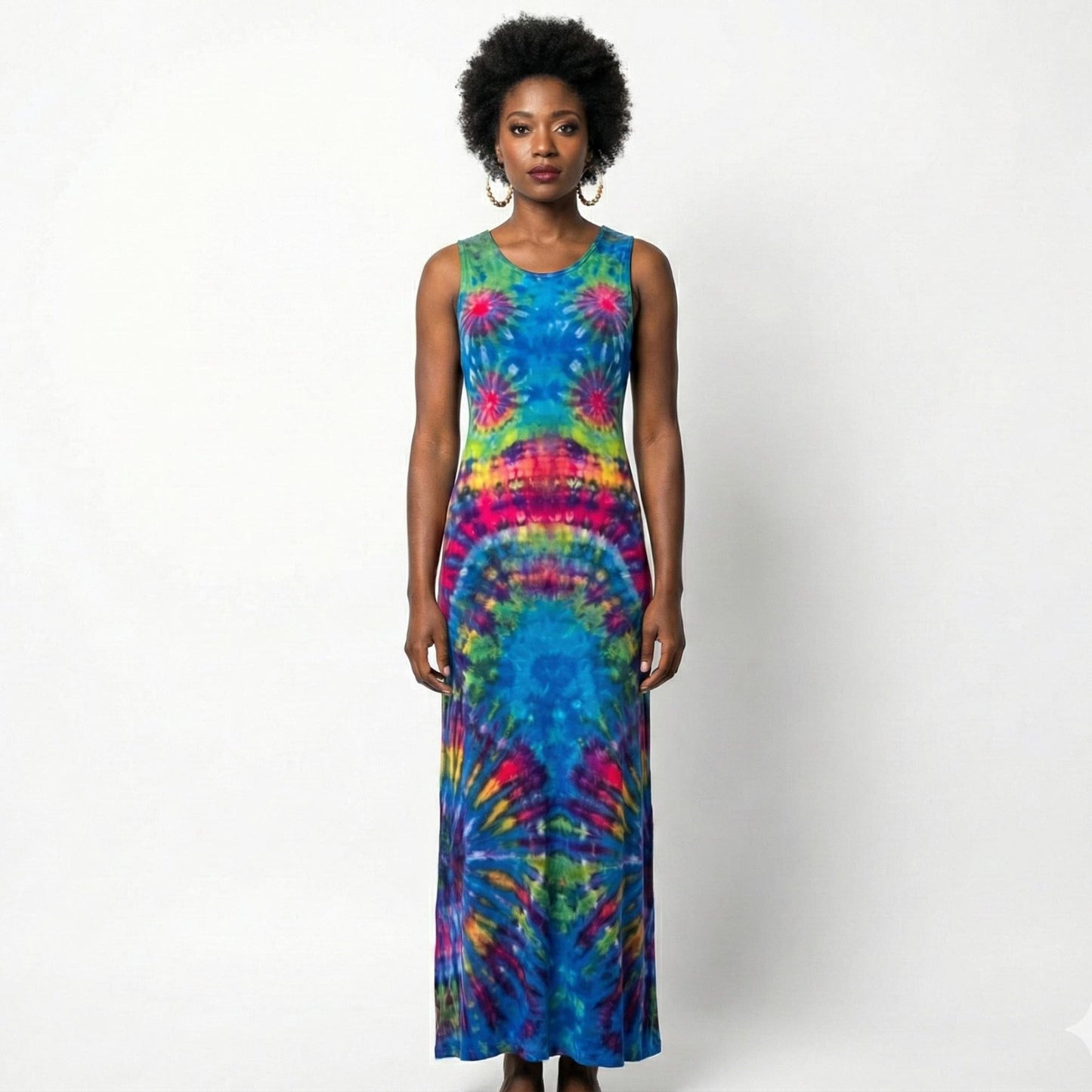 Woman wearing a tie-dye dress on a white background. SanJules