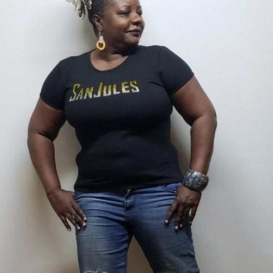 Black Sanjules Signature T-shirt with gold rhinestone design, worn by a woman.