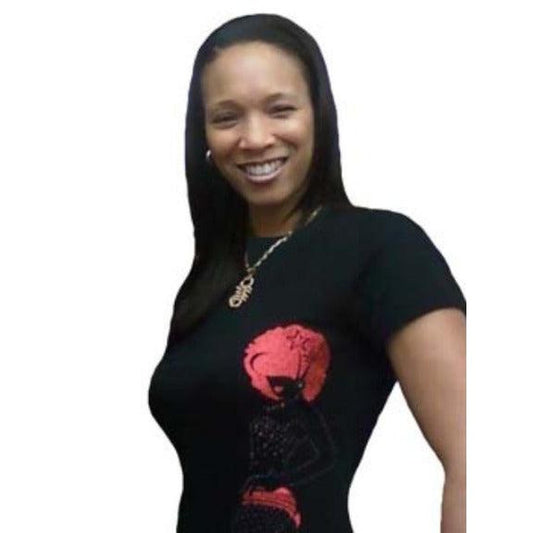 Woman smiling, wearing a black t-shirt with a red rhinestone and reflective film afro design.