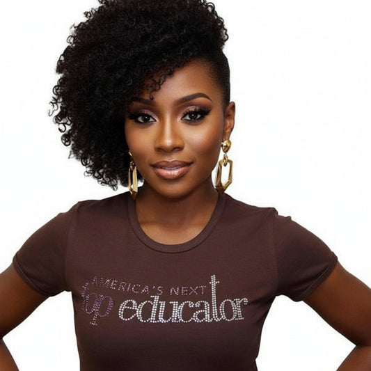 Woman in a brown short-sleeve t-shirt with "America's Next Top Educator" in purple and white rhinestones.