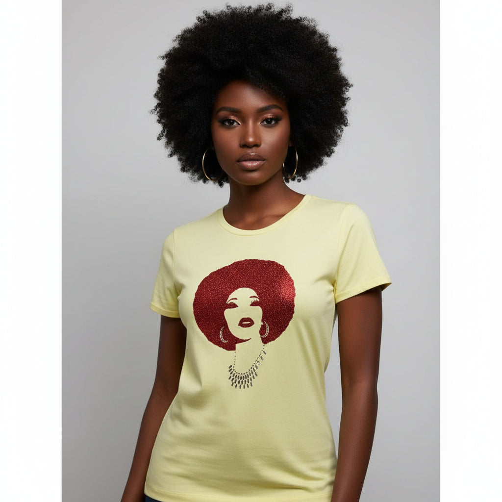 Woman in a pale yellow t-shirt with a red rhinestone and reflective film Foxy Afro design.