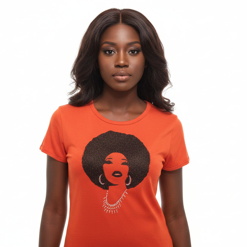 Woman in an orange Foxy Metallic Black Afro Women's T-Shirt with rhinestone details.