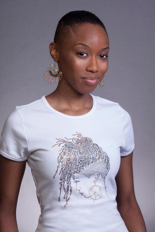 Woman in white fitted t-shirt with a stunning rhinestone loc design, showcasing natural hair pride.