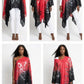 Red and black patterned poncho worn by a model on a white background