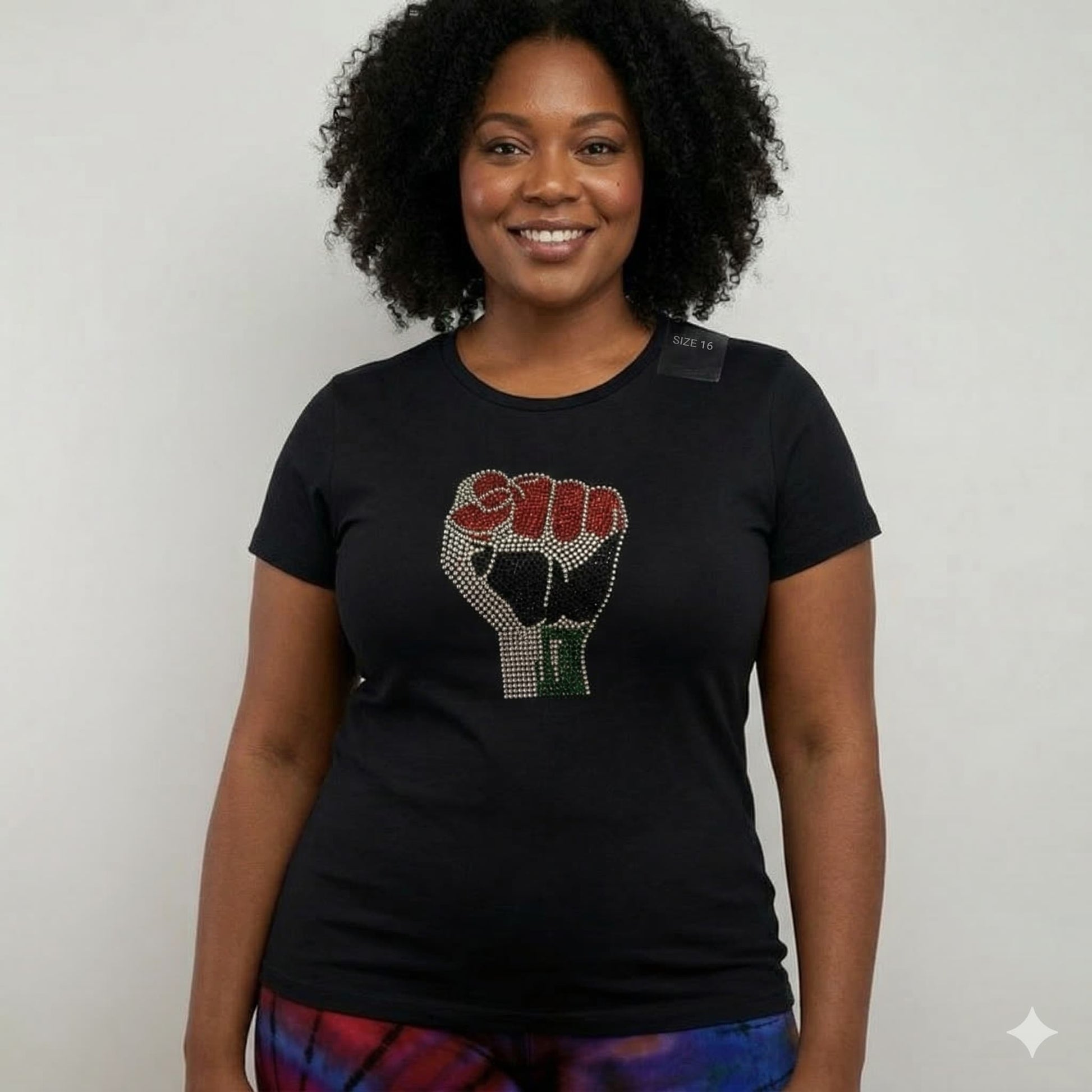 Unisex black cotton t-shirt with a rhinestone Black Power fist in red, black, and green.