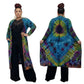 Woman wearing a colorful tie-dye duster with a black top and pants under