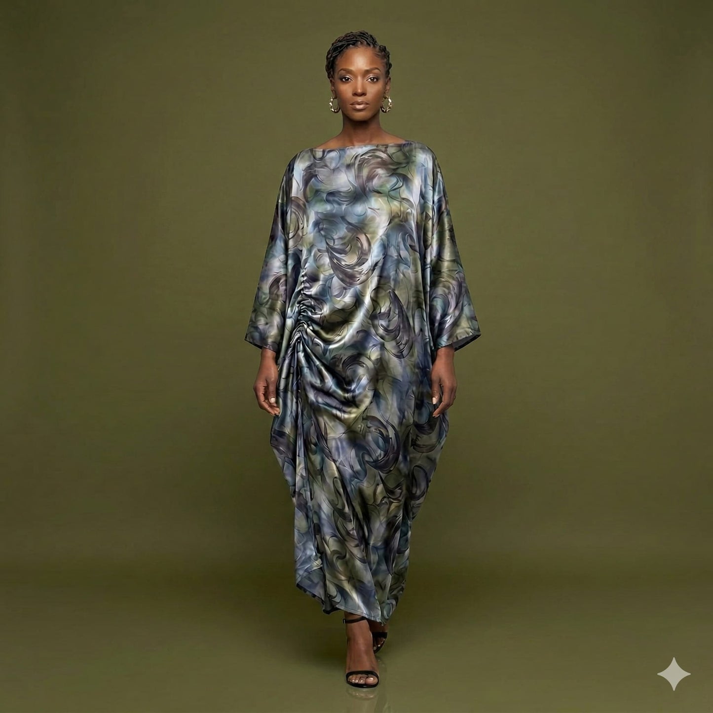 Woman wearing a Boubou dress on a green background