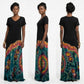 A woman modeling a short-sleeve dress has a solid black upper bodice and a long tie-dye skirt.