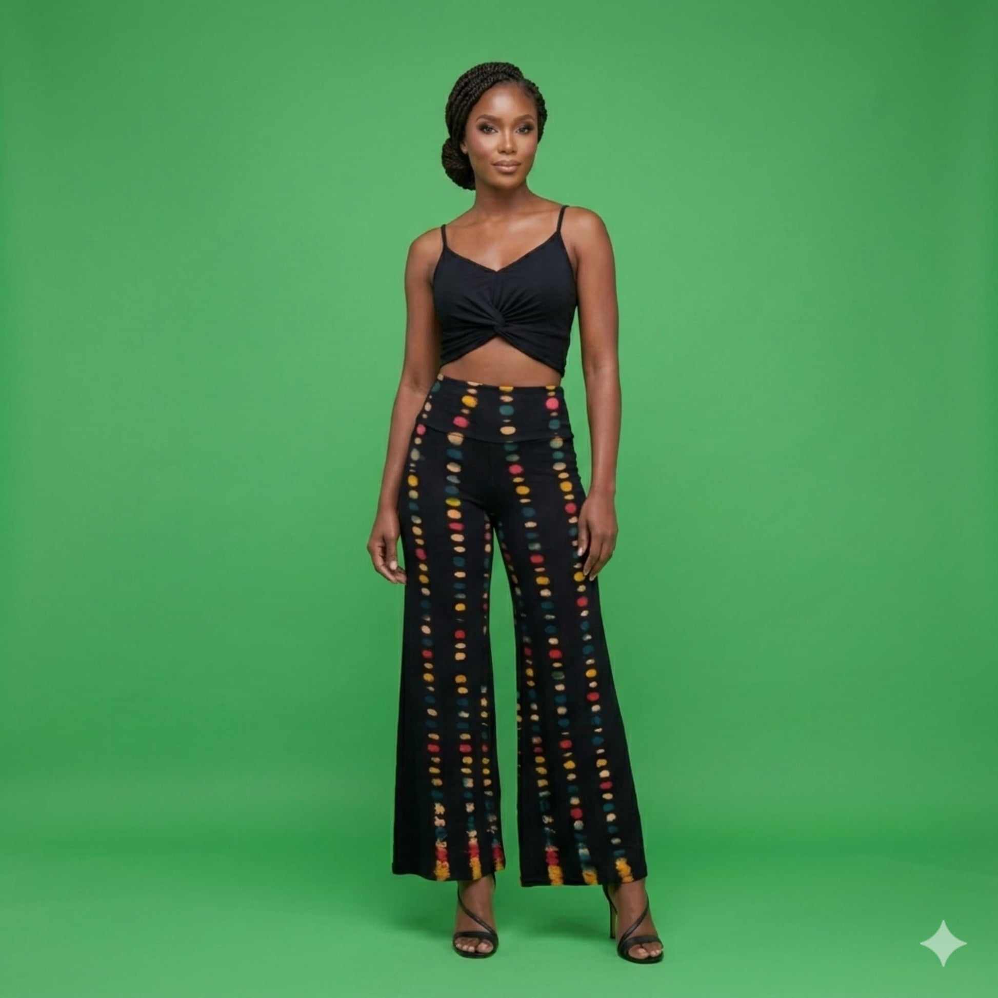 Woman wearing high waisted pants against a green background