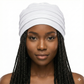 Woman wearing a white hat with braided hair on a white background