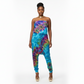 Woman wearing a colorful tie-dye jumpsuit on a white background