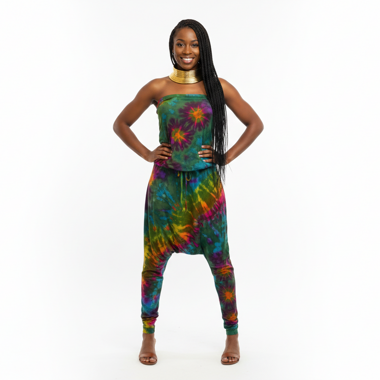 Woman wearing a colorful tie-dye jumpsuit on a white background