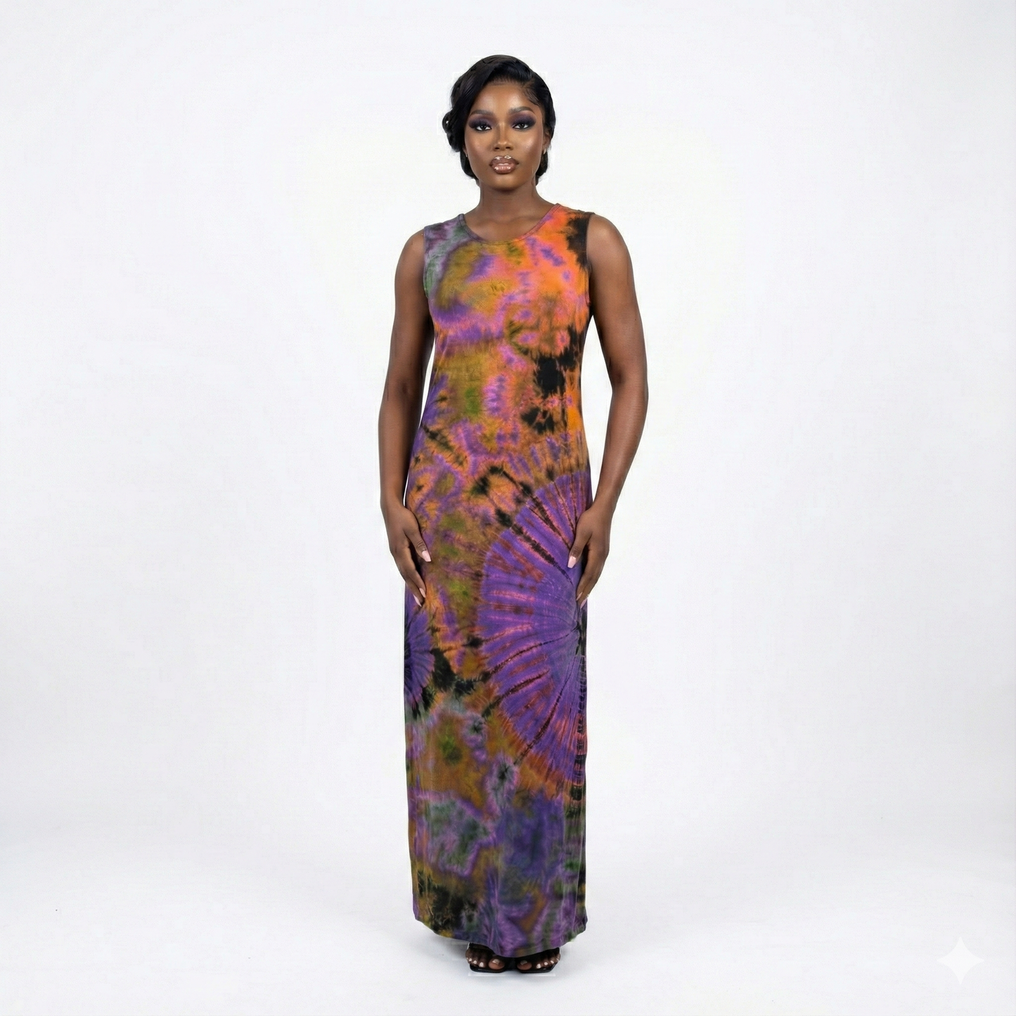 Woman wearing a colorful tie-dye dress on a white background