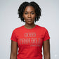 Woman wearing a fitted red combed cotton t-shirt with "GOOD TROUBLE JOHN LEWIS" in sparkling rhinestone lettering.