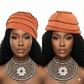 Two women wearing orange hat and intricate necklaces on a white background