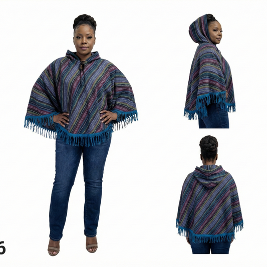 Woman wearing a striped poncho with fringe details on a white background