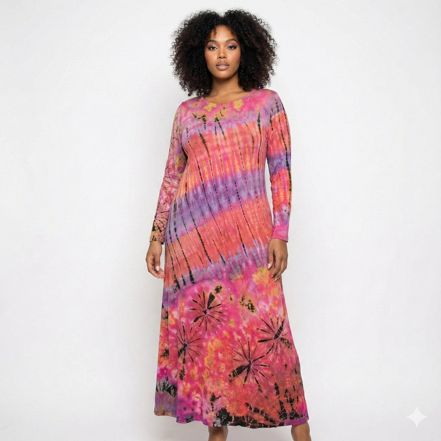 Woman wearing a tie-dye dress with pink, purple, and orange colors on a white background