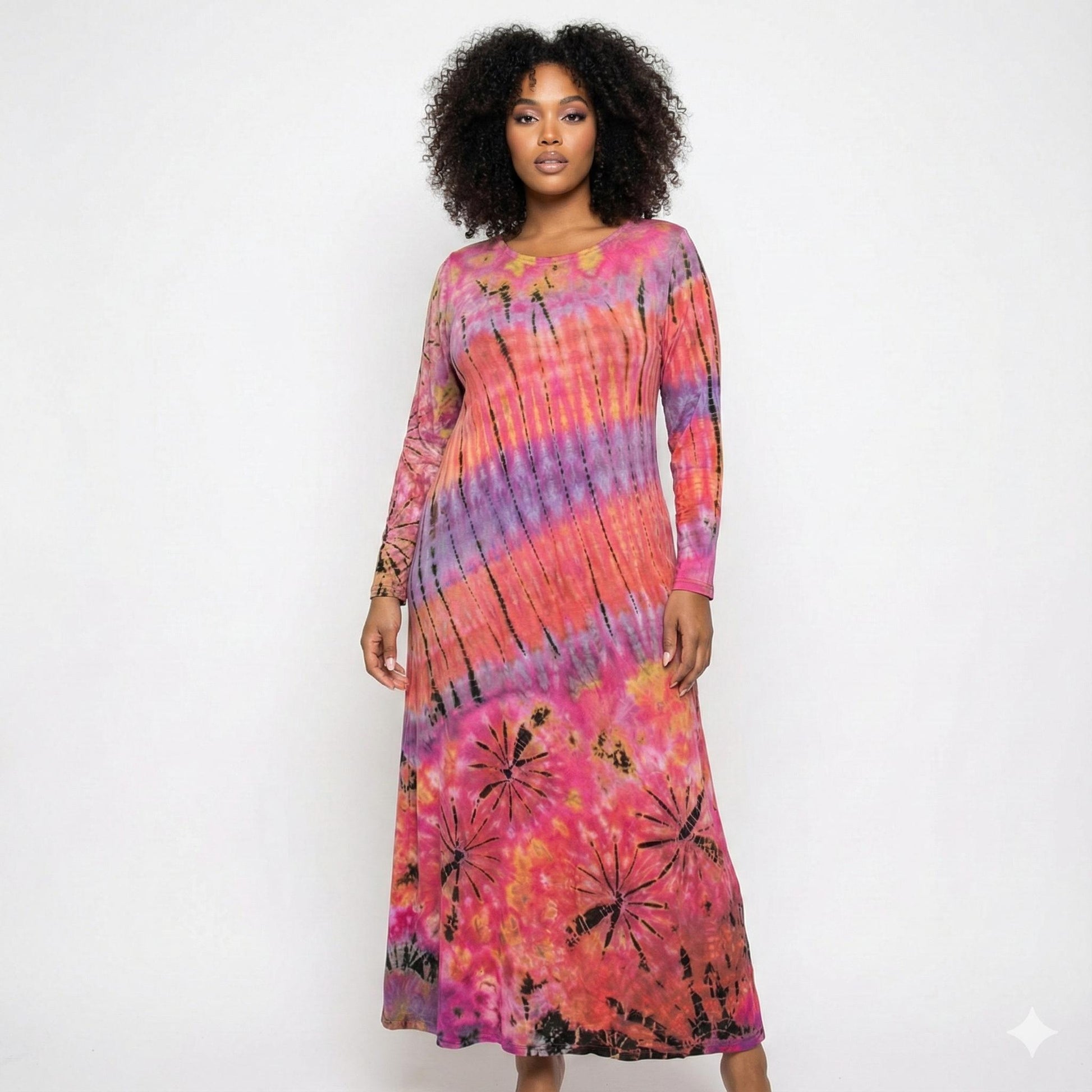 Woman wearing a tie-dye dress with pink, purple, and orange colors on a white background