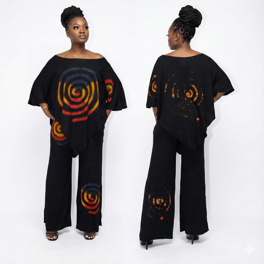 Woman wearing a black outfit with colorful spiral patterns on a white background