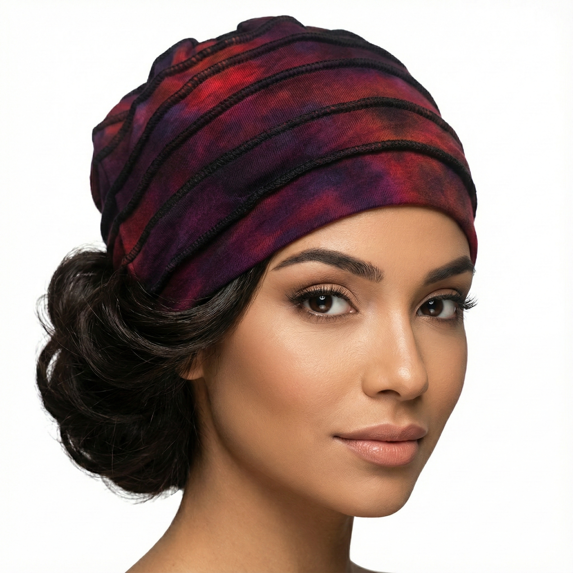 Woman wearing a tie dye hat on a white background