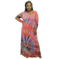 Woman wearing a tie-dye dress with long sleeves on a white background