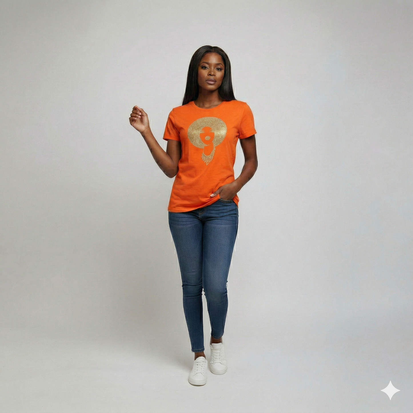 Woman in an orange fitted combed cotton tee with a gold rhinestone Afro disco diva design