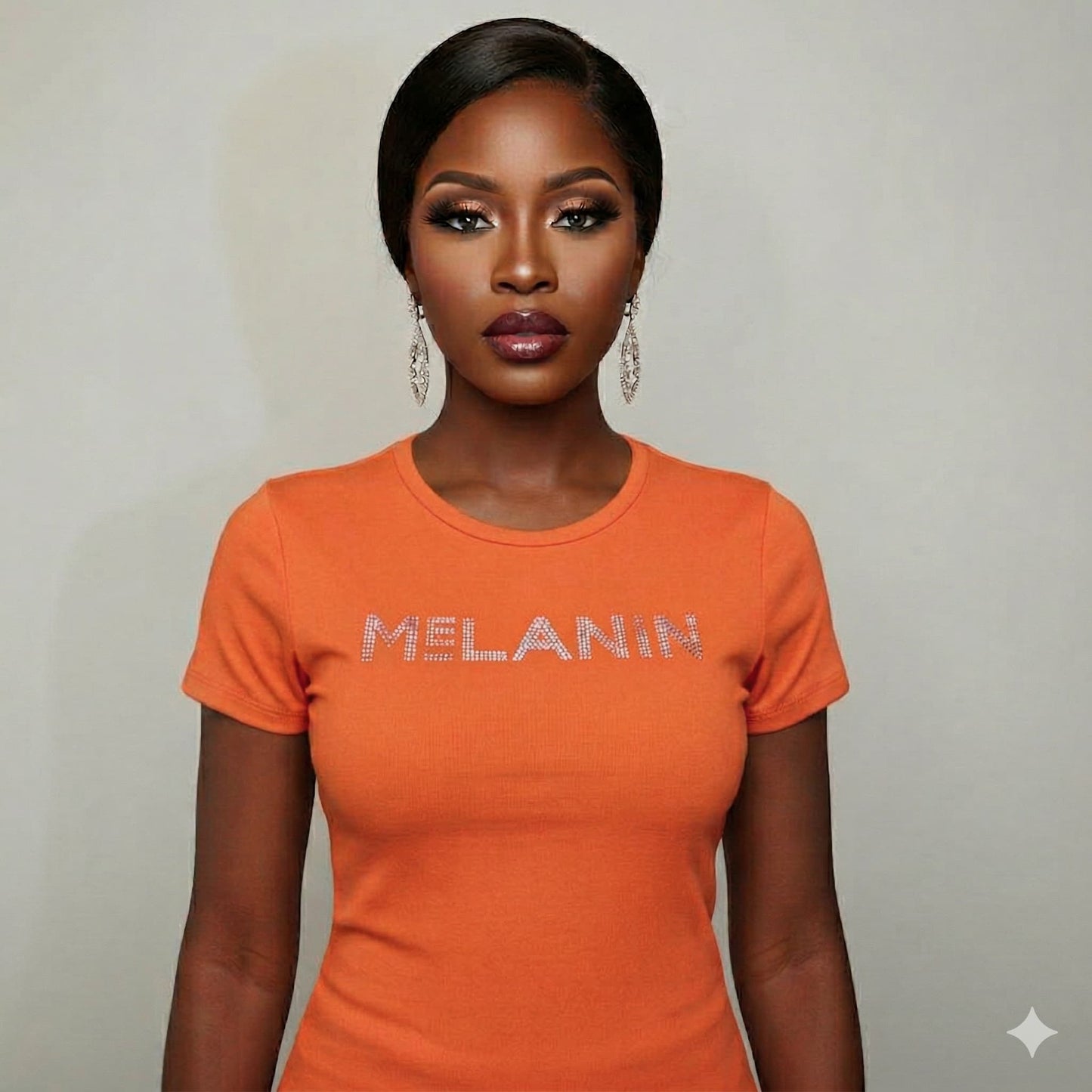 Woman wearing an orange Melanin Unisex T-Shirt with "MELANIN" in sparkly letters.