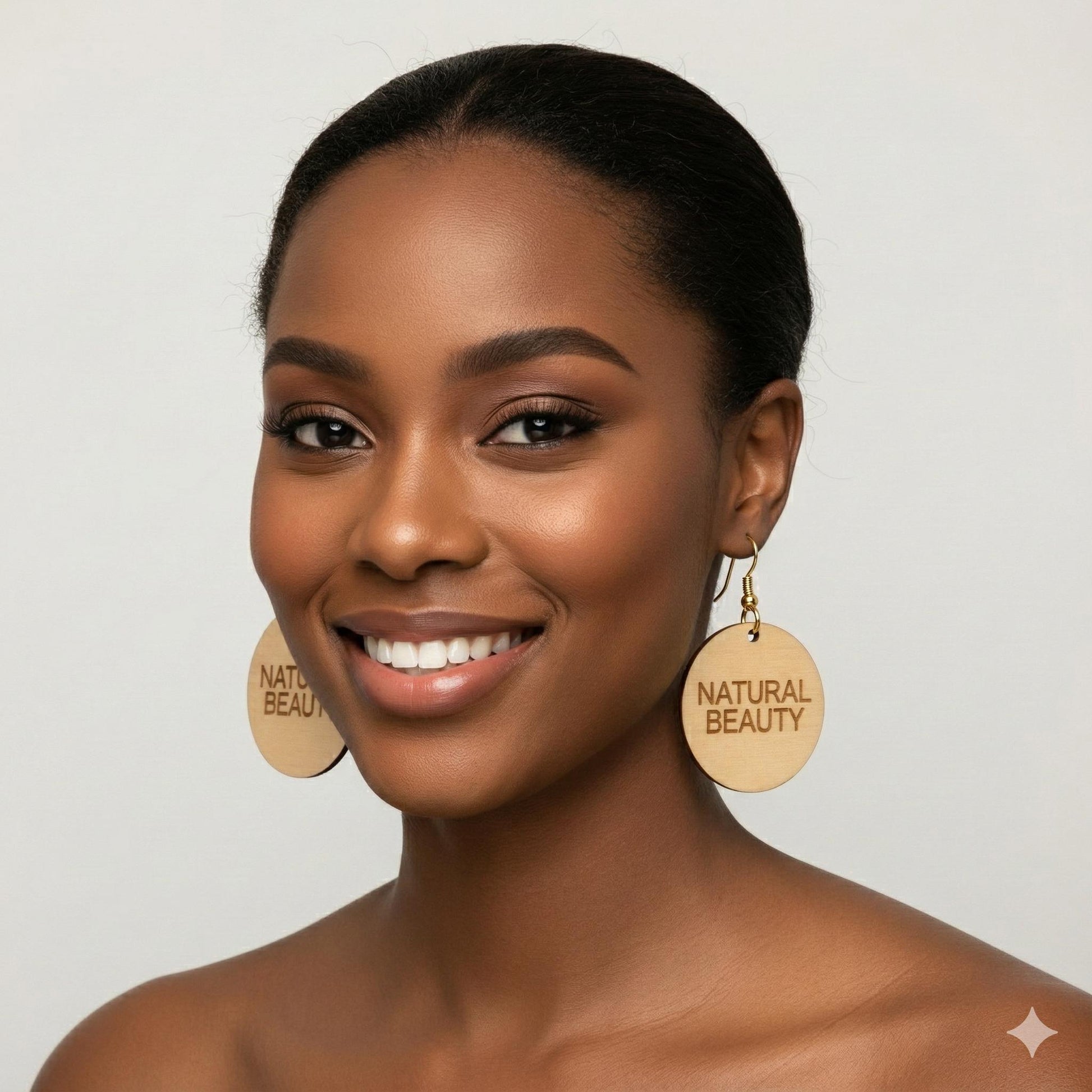 Woman wearing woooden earrings with 'Natural Beauty' text on a plain background