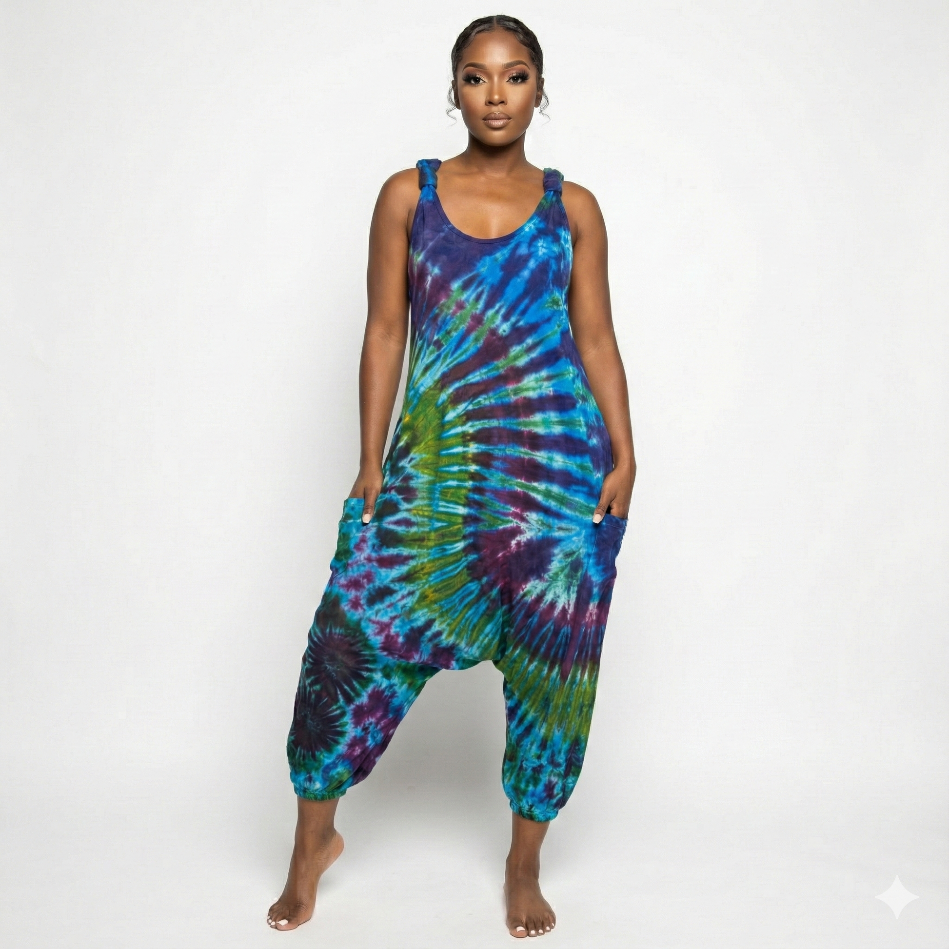 Person wearing a tie-dye jumpsuit on a white background