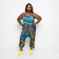 Woman wearing a tie-dye jumpsuit on a white background