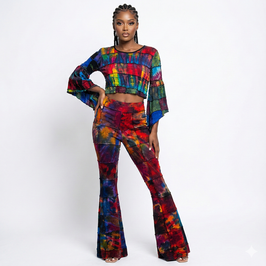 Woman wearing a colorful tie-dye top and bottom on a white background