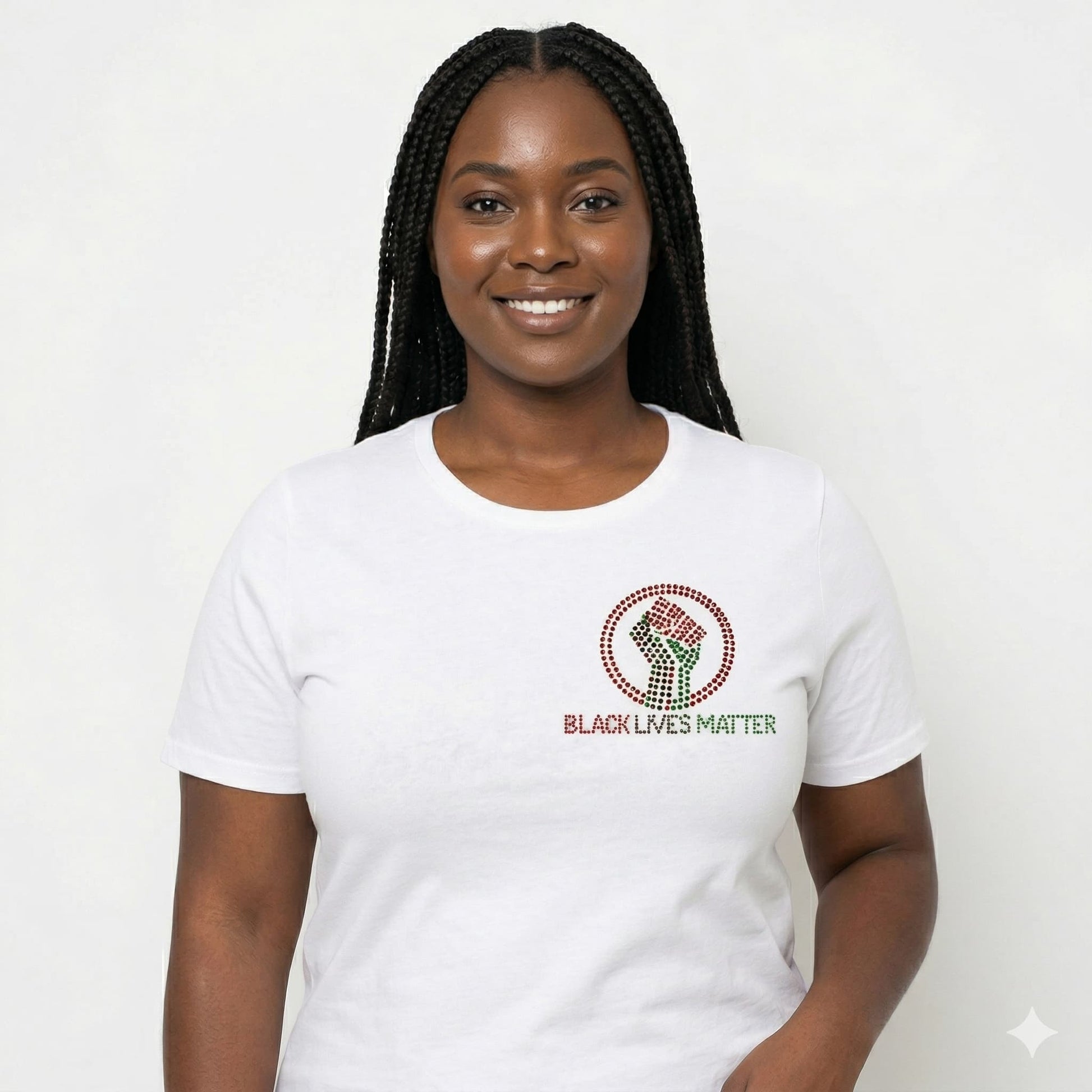 Woman in white BLM Black Lives Matter rhinestone t-shirt with a raised fist design.