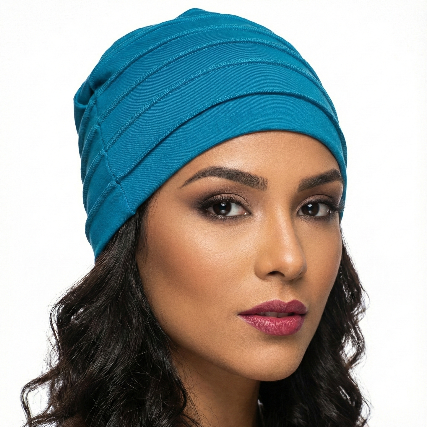 Woman wearing a blue hat on a white background