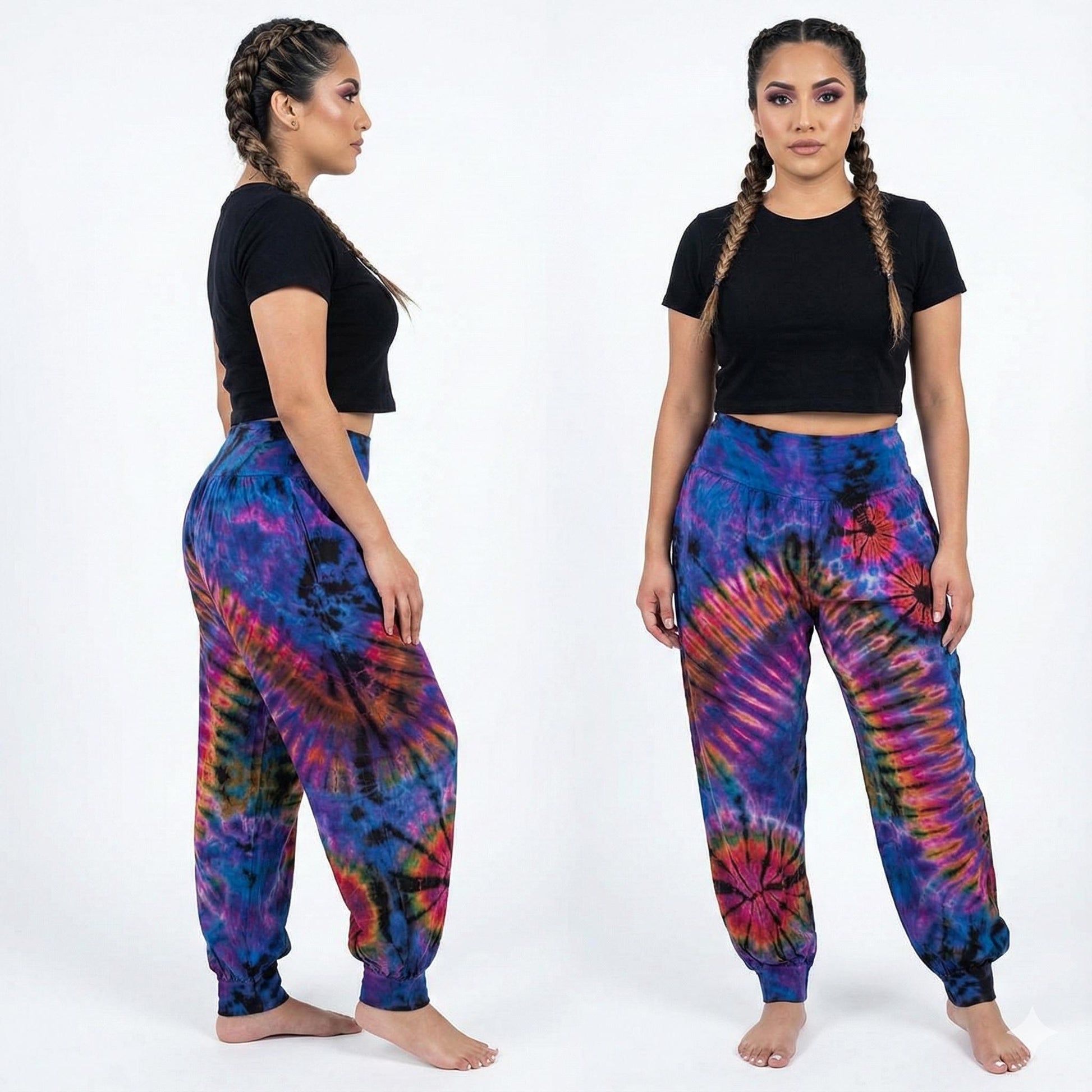 Woman wearing tie-dye pants and a black crop top on a white background