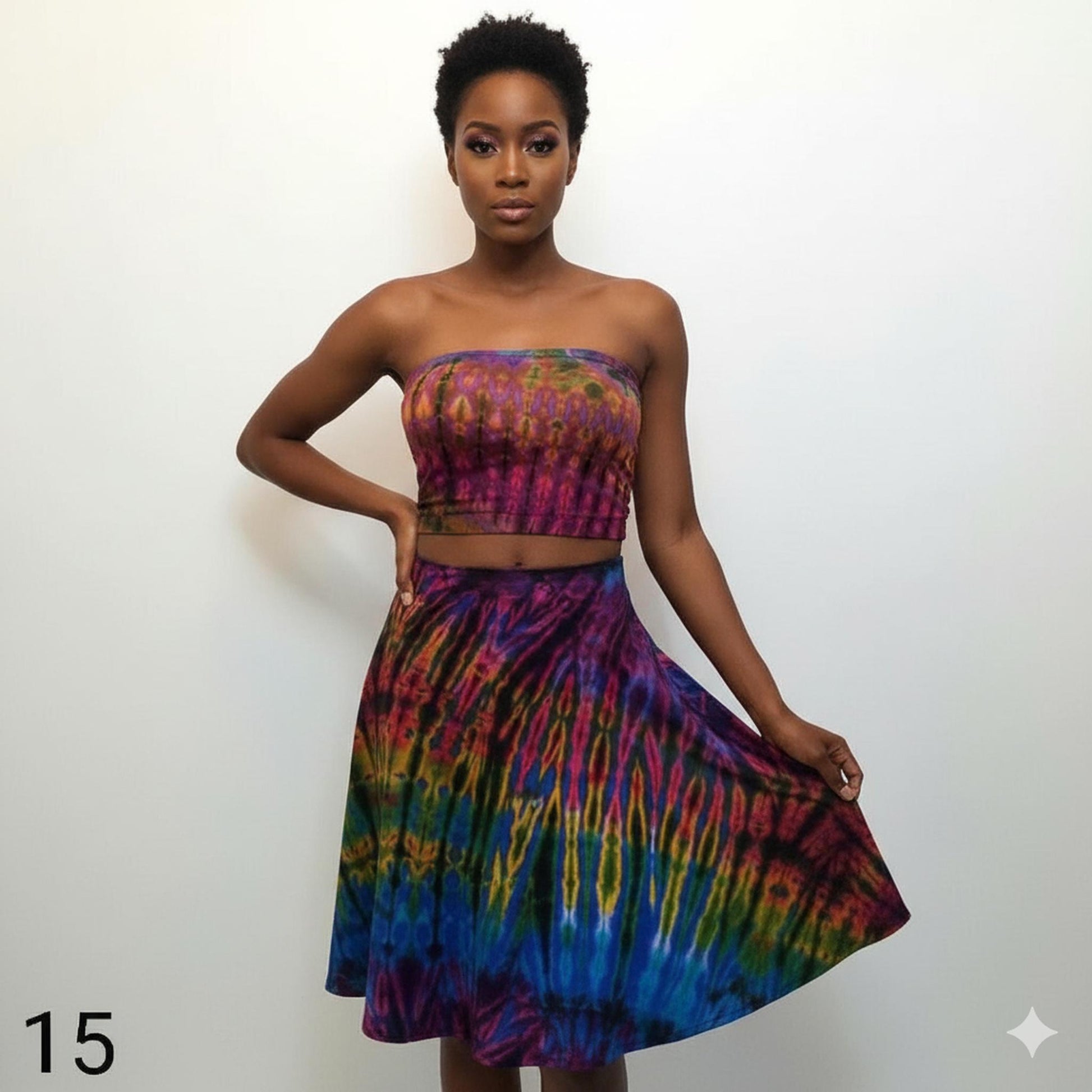 Woman wearing a colorful tube top with a tie-dye pattern on a white background
