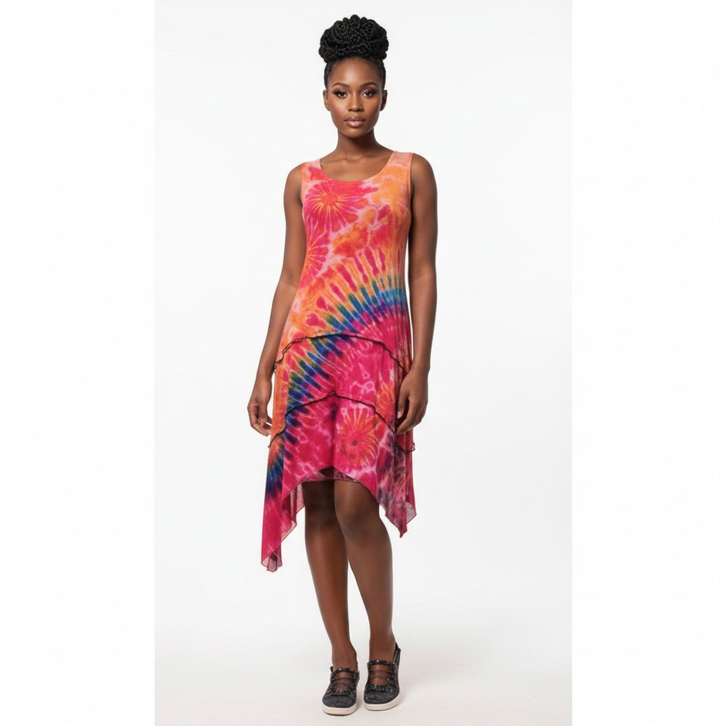 Woman wearing a tie-dye dress on a white background