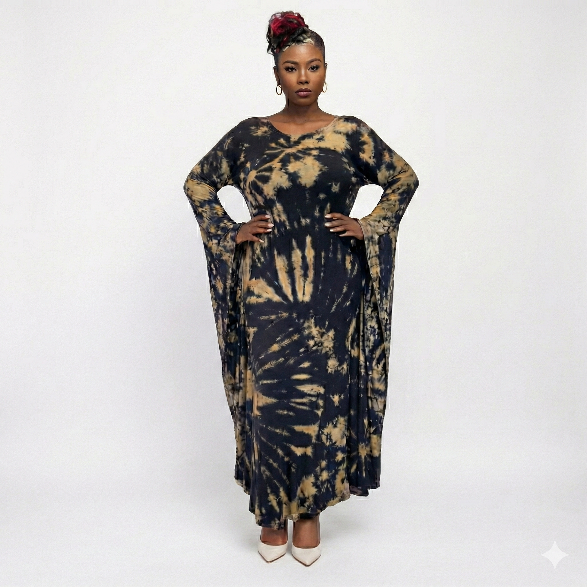 Woman wearing a tie-dye dress on a white background