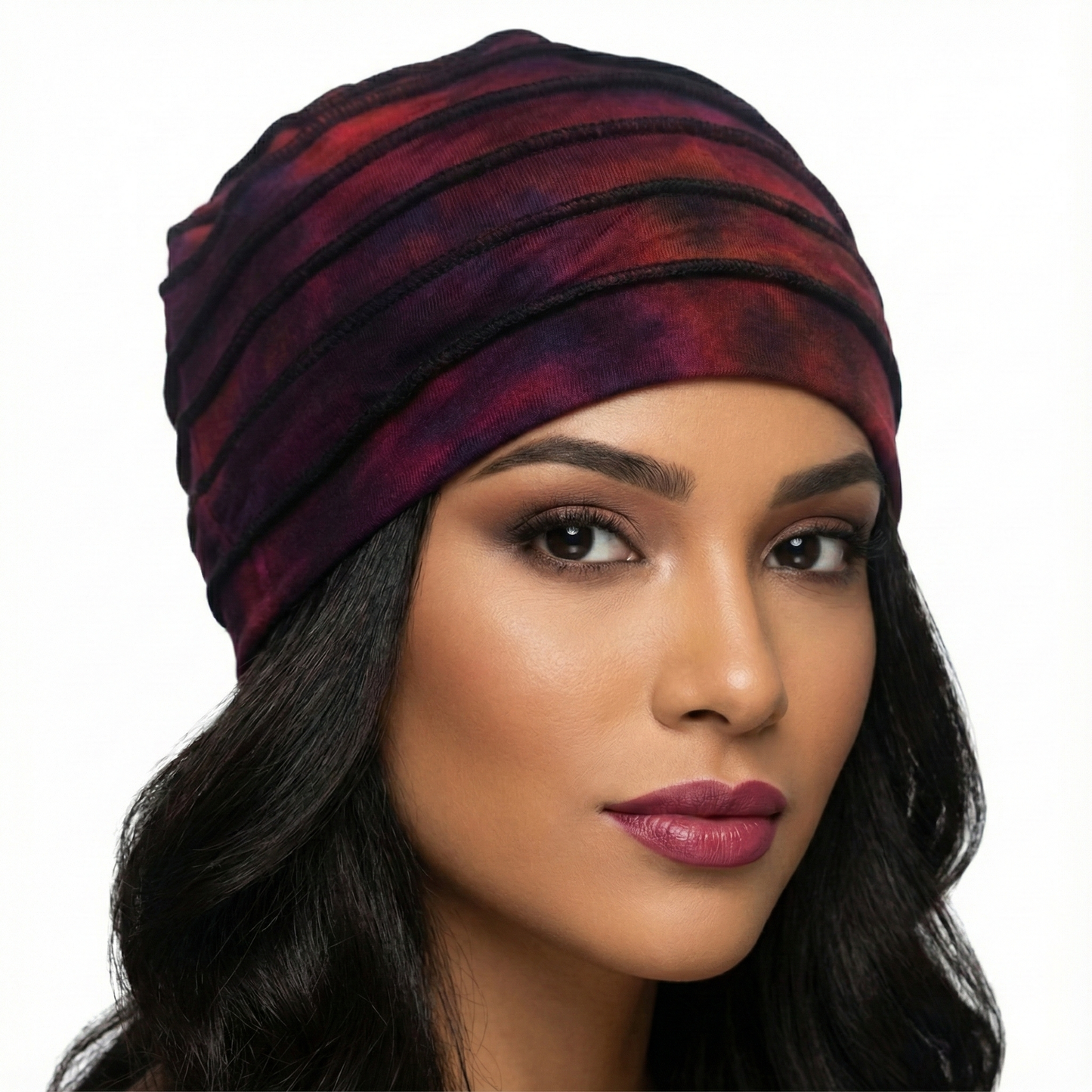 Woman wearing a tie dye hat on a white background