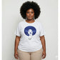 Plus-size woman in white t-shirt with royal blue rhinestone afro design.