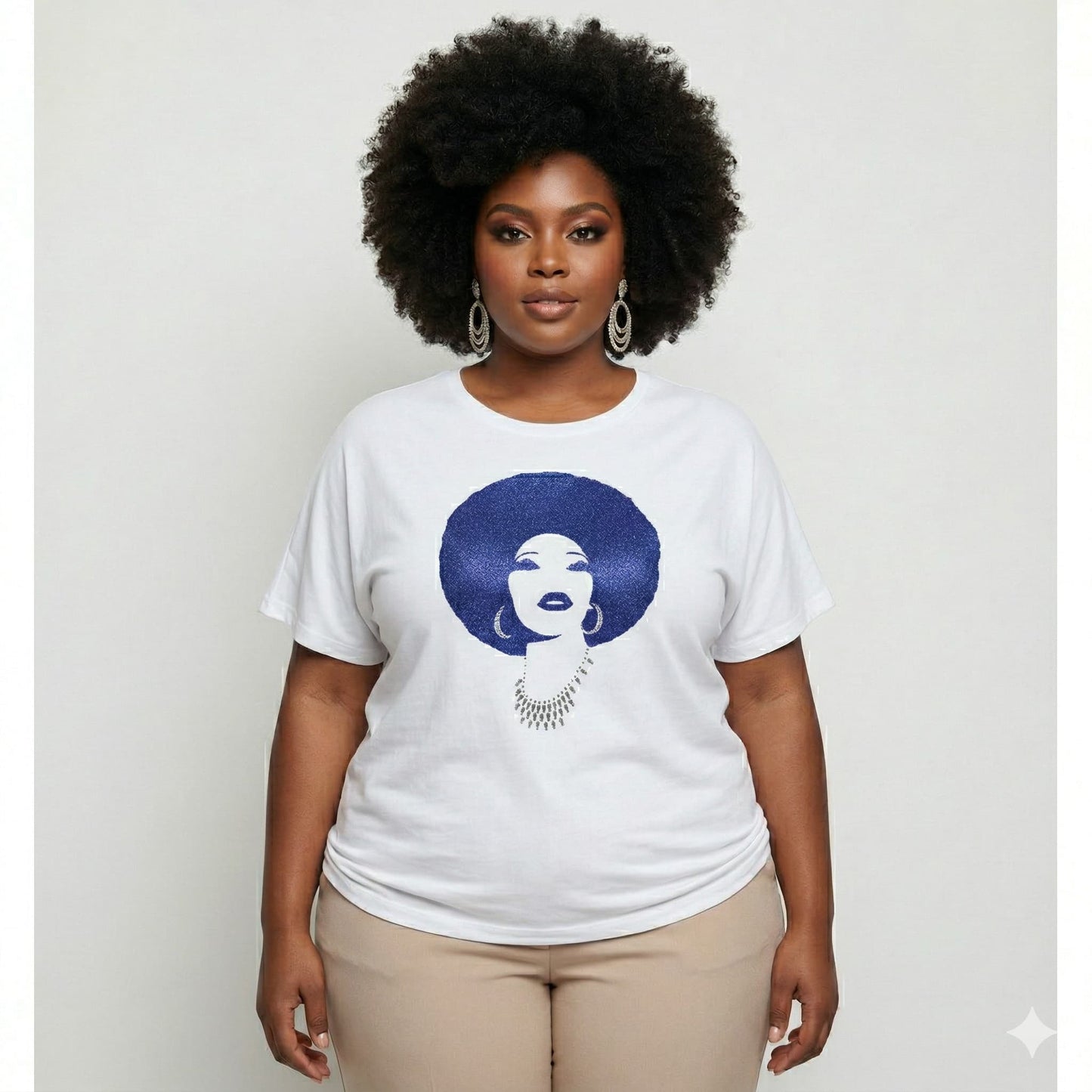 Plus-size woman in white t-shirt with royal blue rhinestone afro design.