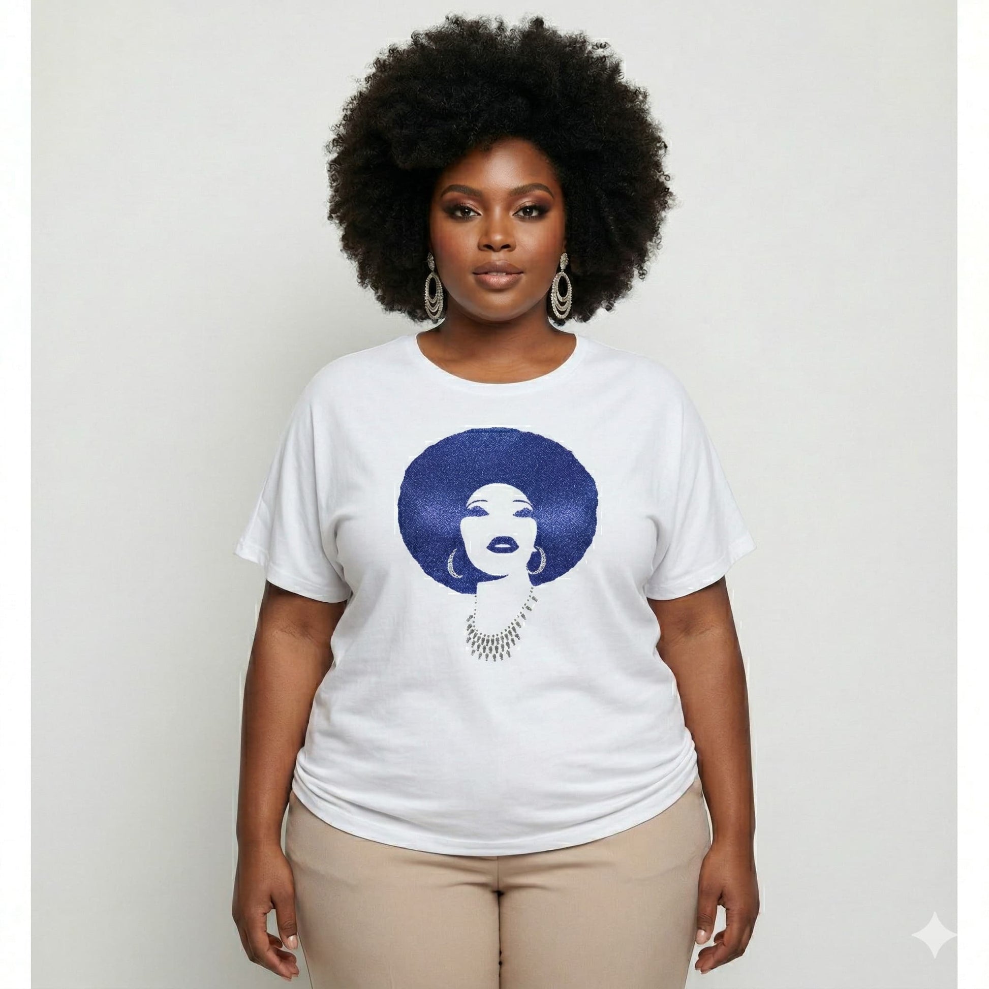 Plus-size woman in white t-shirt with royal blue rhinestone afro design.