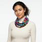 Woman wearing a colorful tie dye scarf on a white background