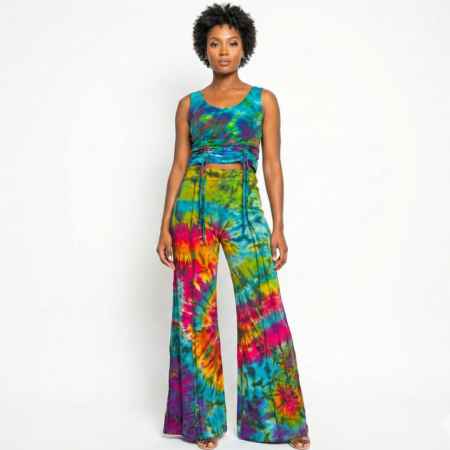 Woman wearing a tie-dye outfit on a white background