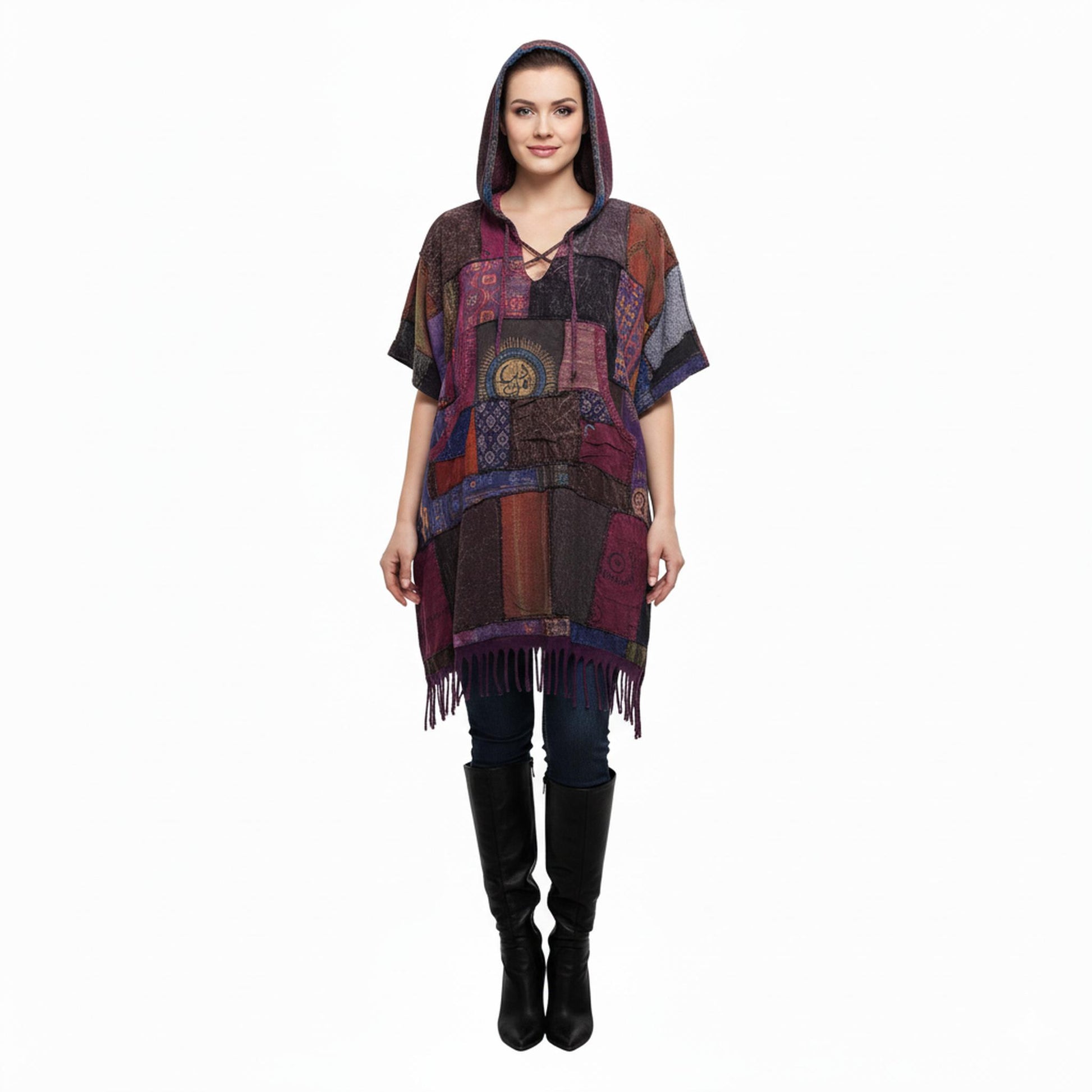 Woman wearing a colorful patchwork  poncho on a white background